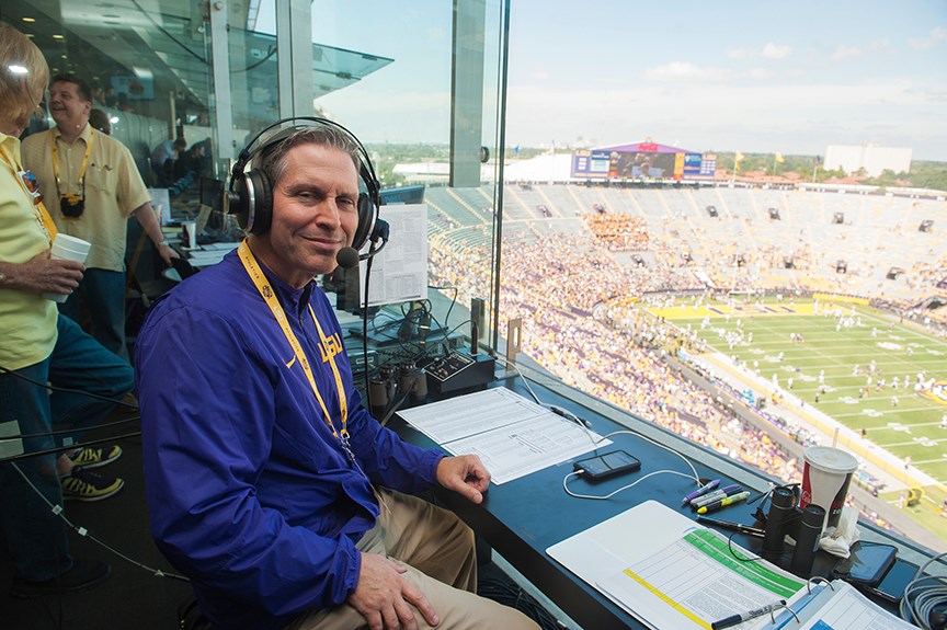 Working as the football PA announcer in LSU’s Tiger Stadium.